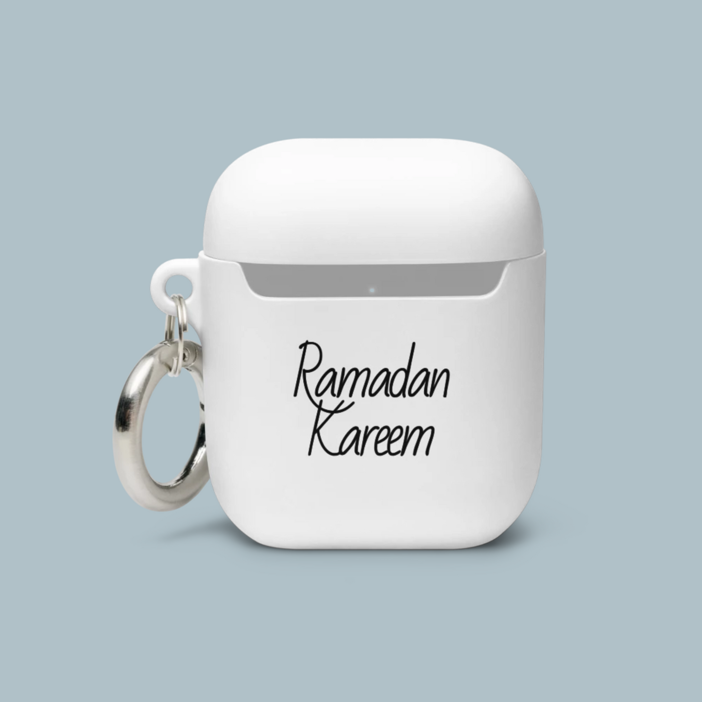 White airpod case with 'Ramadan Kareem' text on a light blue background