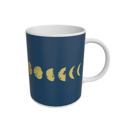 Mug with gold moon phases on a navy background