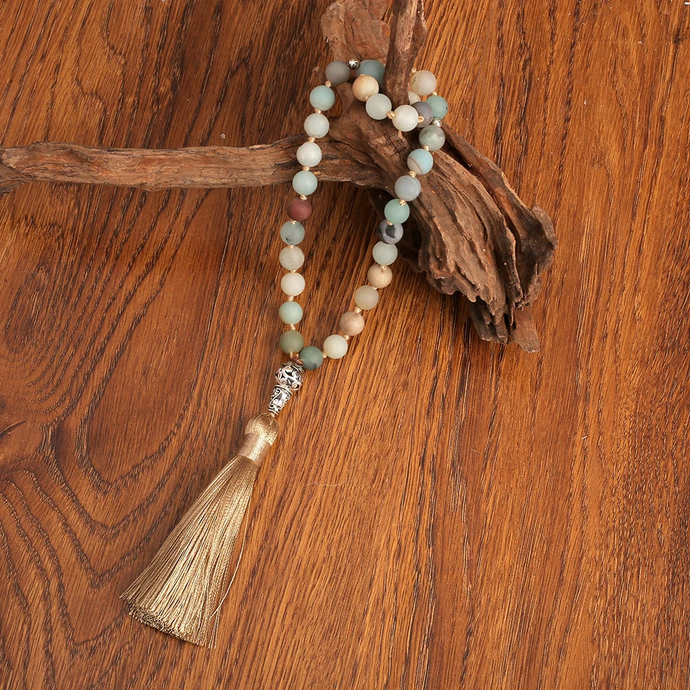 33-bead Amazonite tasbih displayed on driftwood