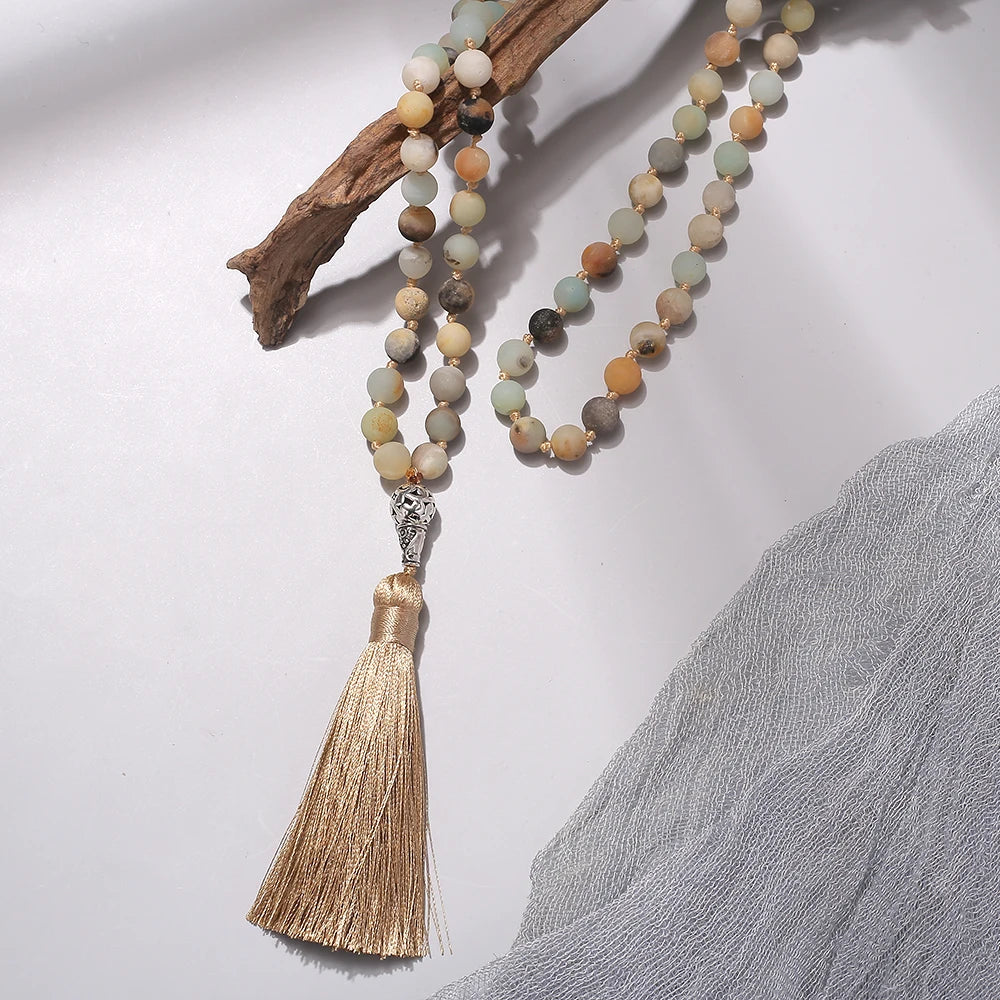 99-bead Amazonite tasbih displayed on driftwood