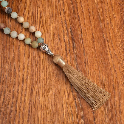 Close-up of Amazonite tassel against wood background