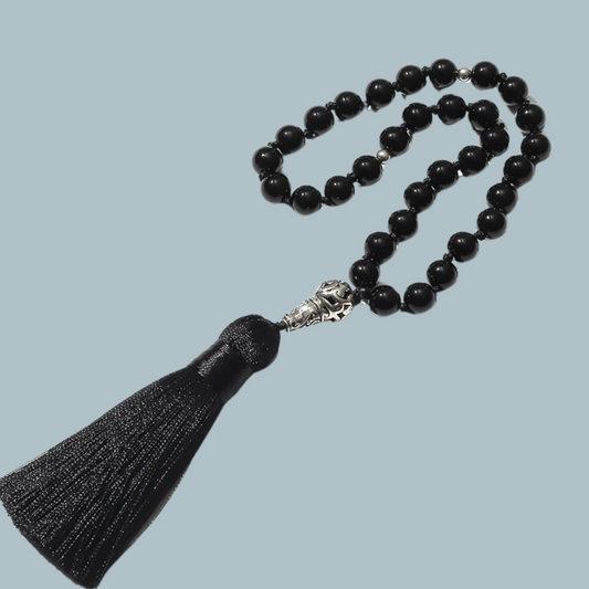 33-bead Black Onyx tasbih with sleek matte finish on display