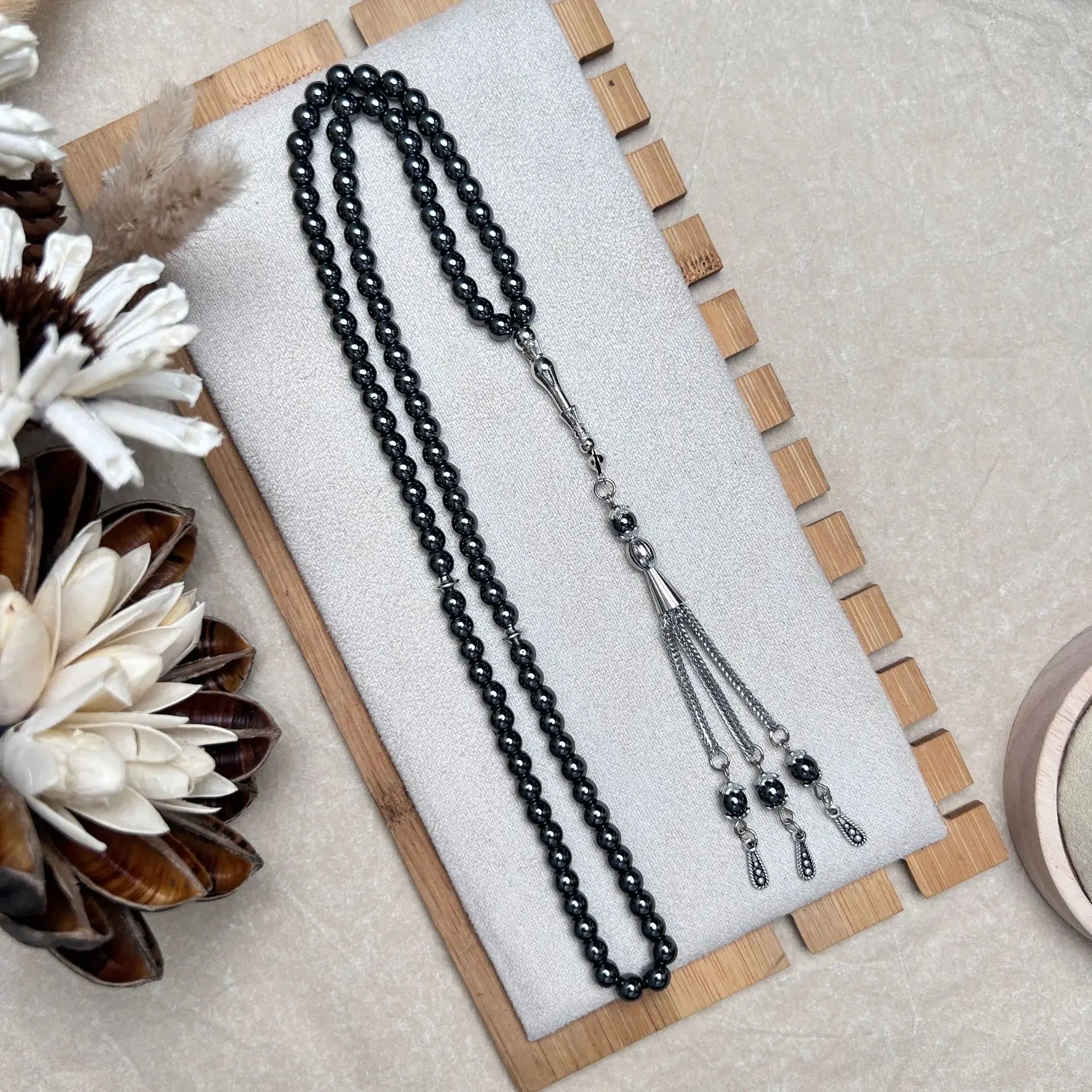 Hematite tasbih with 99 beads styled for reflective use
