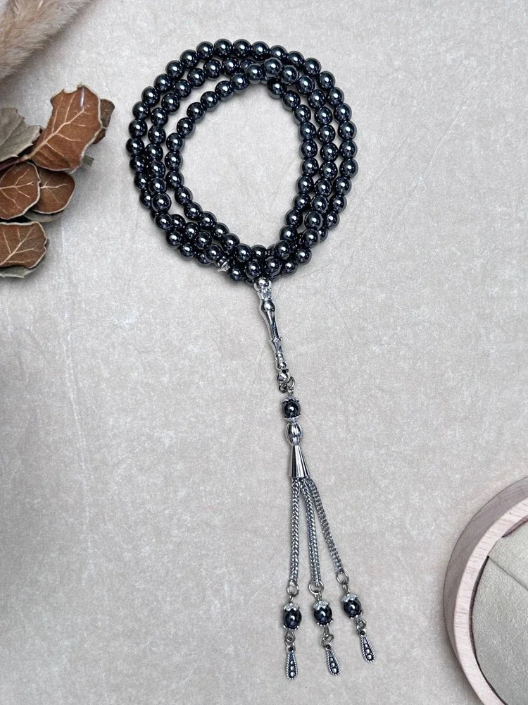 Full view of 99-bead Hematite tasbih in a soft lifestyle setting