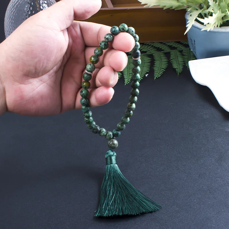 Green Jasper 33-bead tasbih being held in hand
