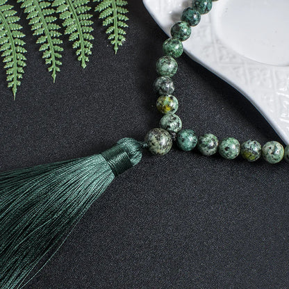 Close-up of 33-bead Green Jasper tasbih showing smooth, unknotted beads