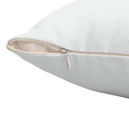 Close-up corner view of pillow showing beige zipper detail