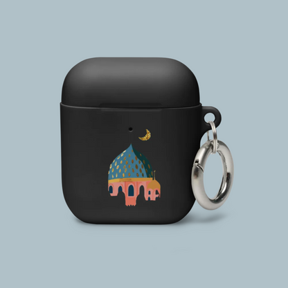 Black airpod case with a colorful illustration of a Masjid and keychain on a light blue background