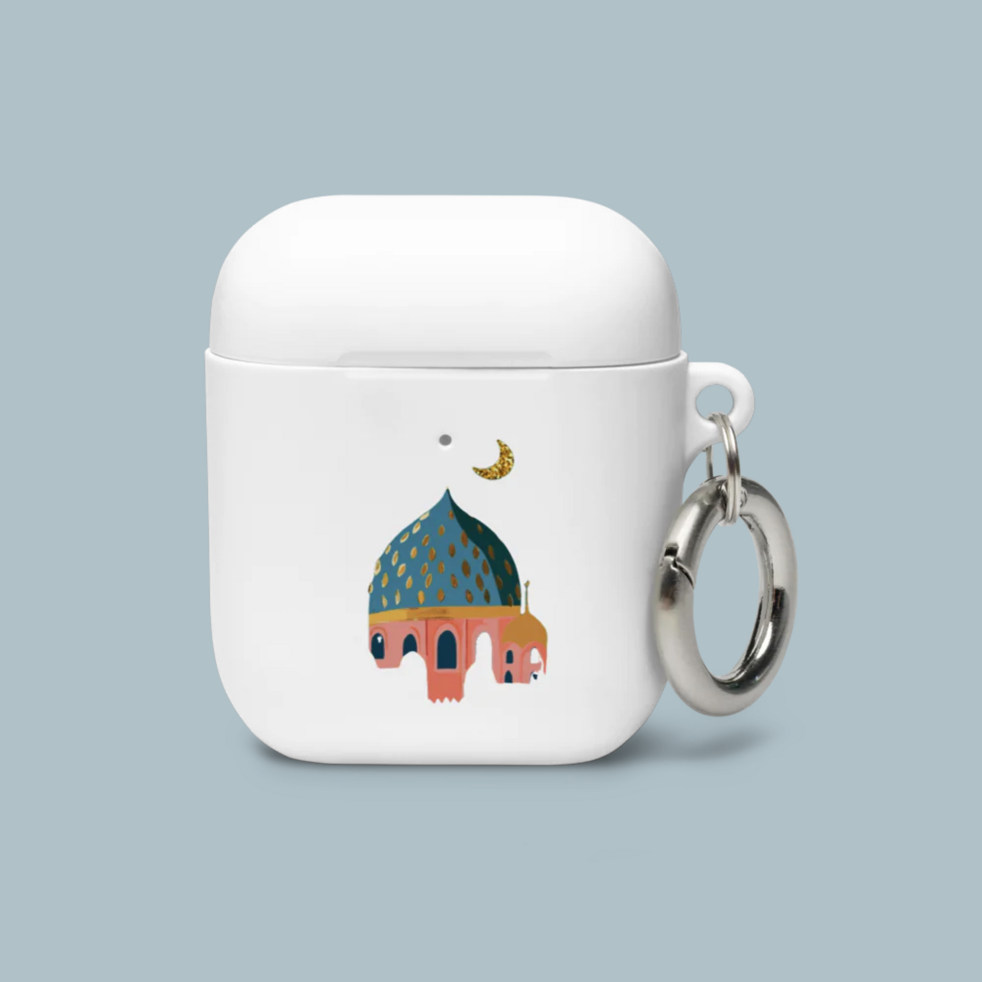 White air pod case with a colorful illustration of a Masjid and keychain on a light blue background