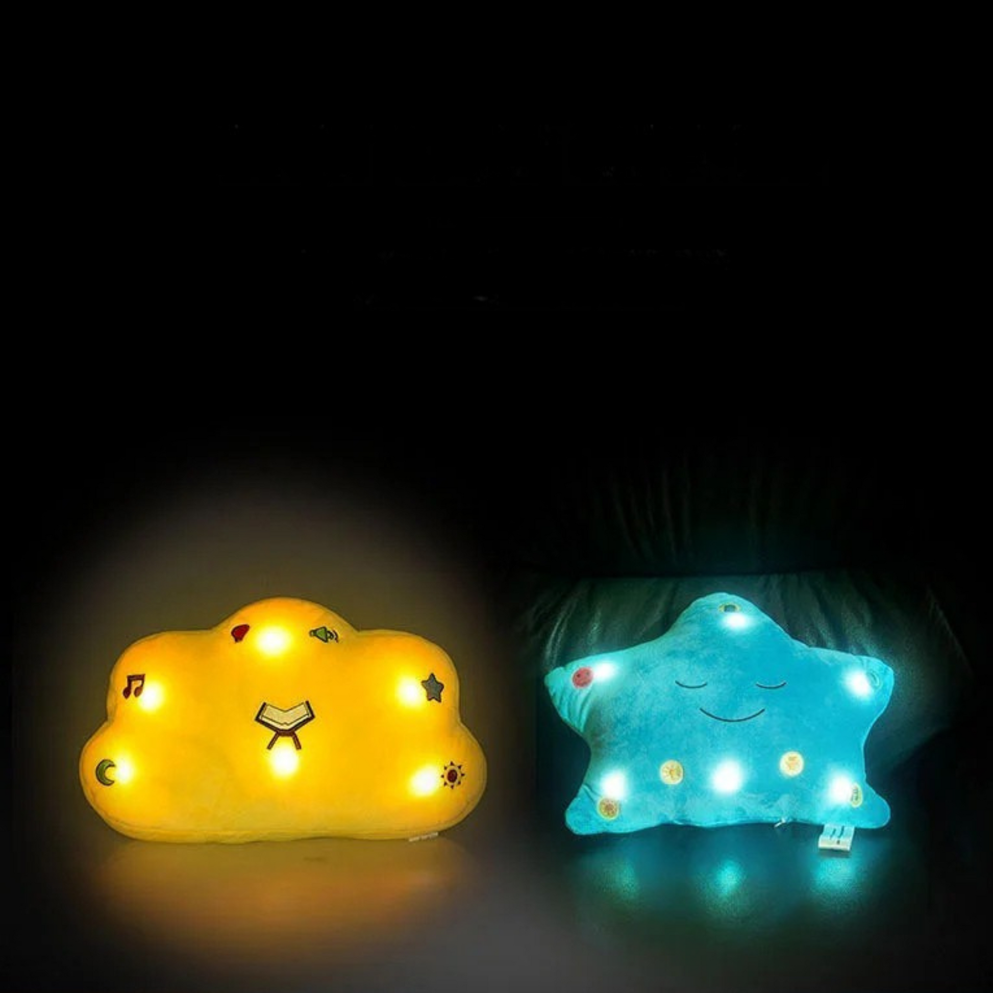 Two cloud-shaped night light pillows, one yellow and one blue, in the dark.
