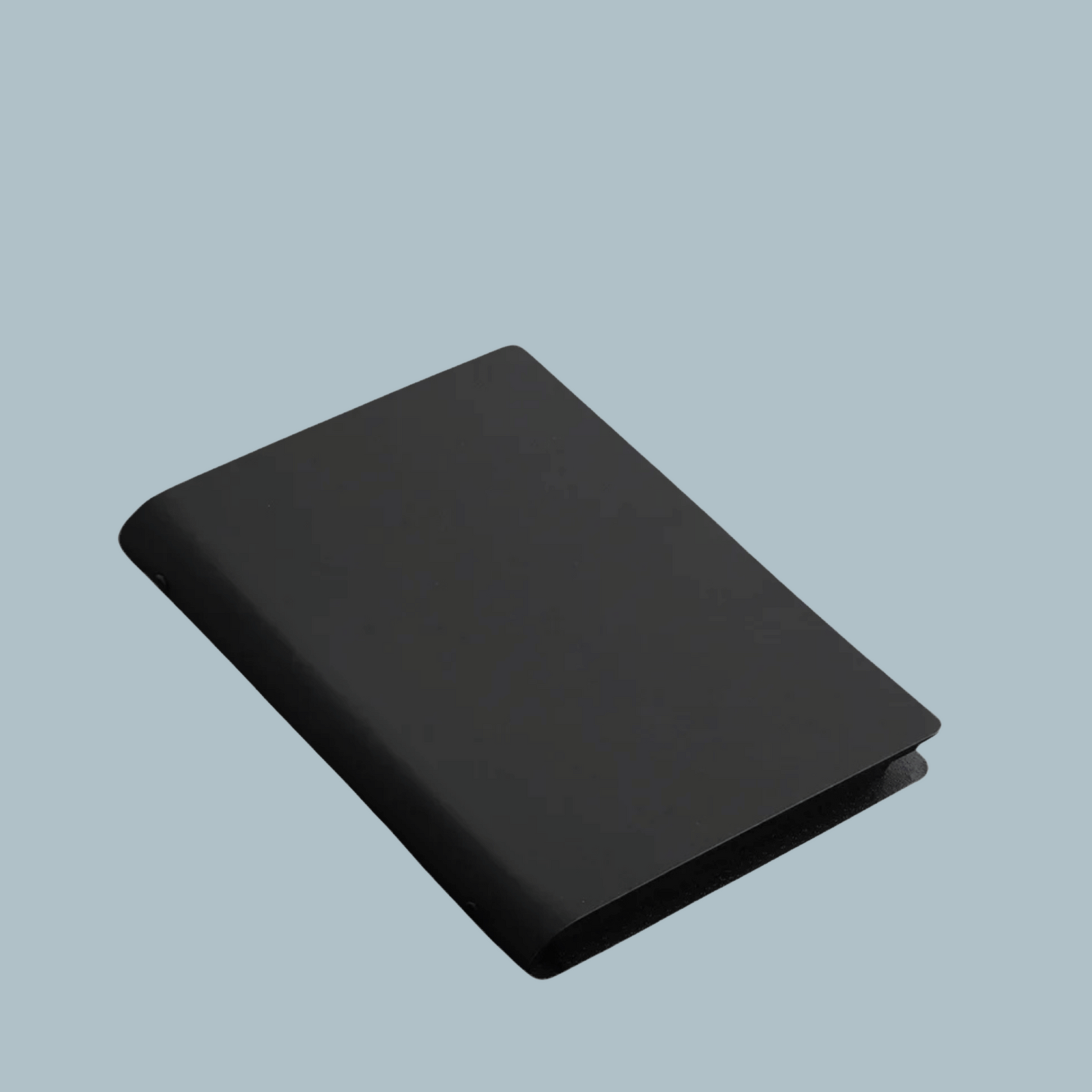 Closed Ramadan Reflection Journal with sleek minimalist black imitation leather cover, A5 size, perfect for spiritual journaling and daily reflections