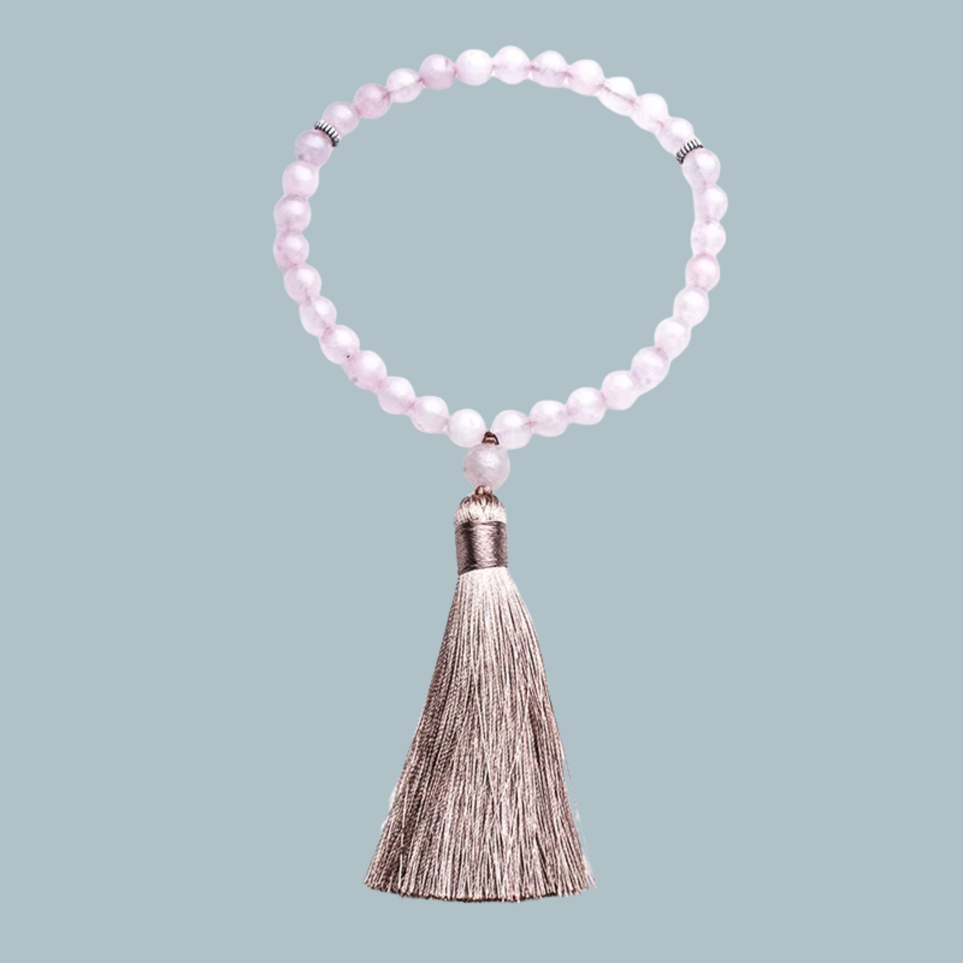Alternate angle of 33-bead Rose Quartz tasbih with natural lighting