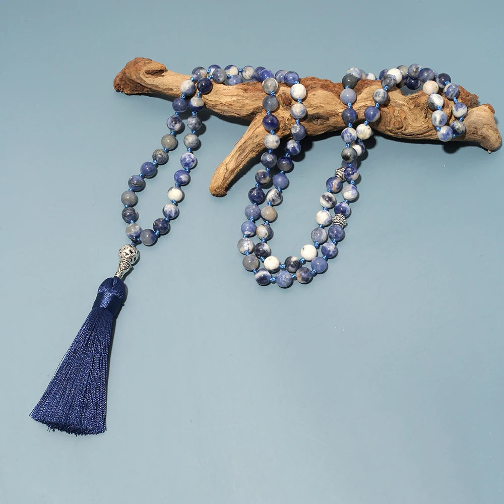  99-bead Sodalite tasbih resting on driftwood