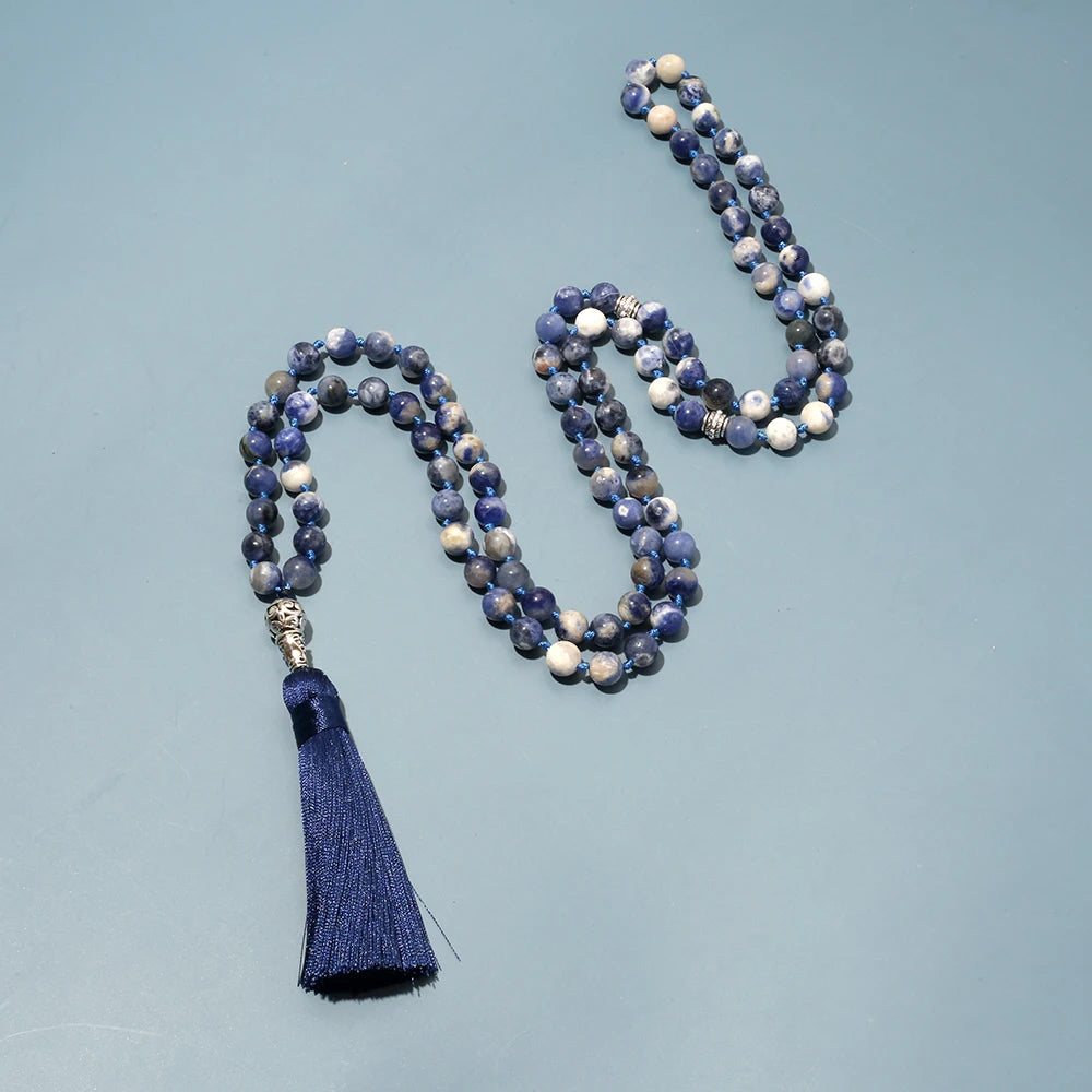 99-bead Sodalite tasbih lying on a neutral, plain background