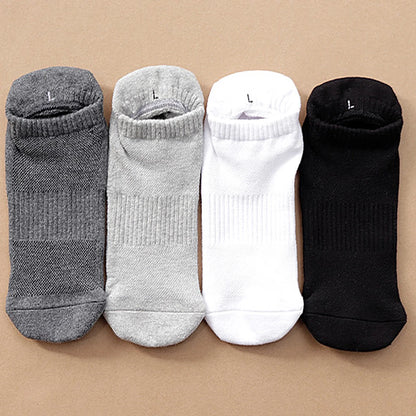 Large size Tawaf Socks shown in all four colors laying flat: dark grey, light grey, white, black